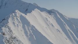 4K aerial stock footage flying by snowy slopes in the Chugach Mountains, Alaska Aerial Stock Footage | AK0001_1749