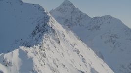 4K aerial stock footage rounding snowy slopes in the Chugach Mountains, Alaska Aerial Stock Footage | AK0001_1750