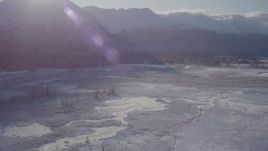 4K aerial stock footage panning across a river valley to snow-capped Chugach Mountains, Alaska Aerial Stock Footage | AK0001_1767
