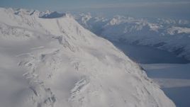 4K aerial stock footage rounding snowy slopes near Harriman Fjord, Chugach Mountains, Alaska Aerial Stock Footage | AK0001_1780