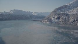 4K aerial stock footage flying over icy water in Harriman Fjord surrounded by snowy mountains, Alaska Aerial Stock Footage | AK0001_1826