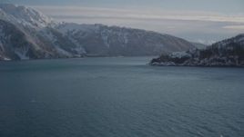 4K aerial stock footage approach mouth of Harriman Fjord at base of snowy mountains, Alaska Aerial Stock Footage | AK0001_1832