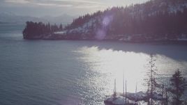 4K aerial stock footage flying over small, snowy island in Port Wells, Alaska Aerial Stock Footage | AK0001_1835