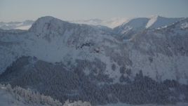 4K aerial stock footage flying over snowy ridge revealing Chugach Mountains, Port Wells, Alaska Aerial Stock Footage | AK0001_1875