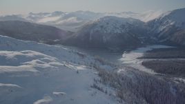 4K aerial stock footage flying over snow covered slopes near Pigot Bay, Alaska Aerial Stock Footage | AK0001_1894