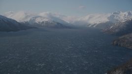 4K aerial stock footage cloud, snow covered Chugach Mountains, Passage Canal, Alaska Aerial Stock Footage | AK0001_1903