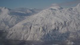 4K aerial stock footage panning across snow covered Chugach Mountains, Alaska Aerial Stock Footage | AK0001_1911