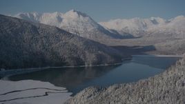 4K aerial stock footage descend toward Carmen Lake, snowy Chugach Mountains, Alaska Aerial Stock Footage | AK0001_1922
