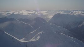 4K aerial stock footage snowy mountain ranges and low clouds in Chugach Mountains, Alaska Aerial Stock Footage | AK0001_1932