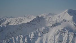 4K aerial stock footage snow covered, windblown mountains in Chugach Mountains, Alaska Aerial Stock Footage | AK0001_1934