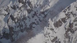 4K aerial stock footage a snowy ridge with mountain goats, Chugach Mountains, Alaska Aerial Stock Footage | AK0001_1951