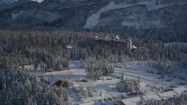 4K aerial stock footage the Alyeska Resort, tilt up to ski lodge, snowy summit, Girdwood, Alaska Aerial Stock Footage | AK0001_1962