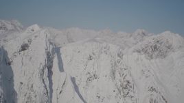 4K aerial stock footage flying toward jagged, snowy ridge in Chugach Mountains, Alaska Aerial Stock Footage | AK0001_1974