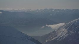 4K aerial stock footage snowy, windblown Kenai Mountains, Turnagain Arm of the Cook Inlet, Alaska Aerial Stock Footage | AK0001_1979