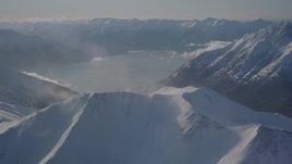 4K aerial stock footage snowy Kenai Mountains across Turnagain Arm of the Cook Inlet, Alaska Aerial Stock Footage | AK0001_1983