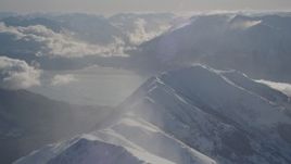 4K aerial stock footage snowy Kenai Mountains across the Turnagain Arm of the Cook Inlet, Alaska Aerial Stock Footage | AK0001_1984