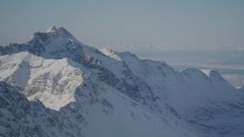4K aerial stock footage snowy Chugach Mountains, Knik Arm of the Cook inlet, Alaska Aerial Stock Footage | AK0001_1986