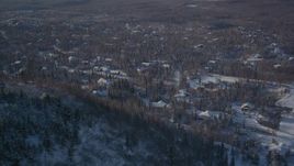 4K aerial stock footage flying by a residential neighborhood in Anchorage, Alaska in snow Aerial Stock Footage | AK0001_2006