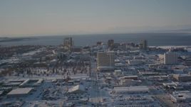 4K aerial stock footage ascending over buildings in snow covered Downtown Anchorage, Alaska Aerial Stock Footage | AK0001_2029