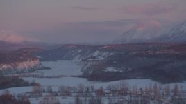4K aerial stock footage snowy Matanuska River Valley homes, Chugach Mountains, Palmer, Alaska, twilight Aerial Stock Footage | AK0001_2099