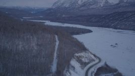 4K aerial stock footage snowy Matanuska River Valley, reveal Chugach Mountains at twilight, Alaska Aerial Stock Footage | AK0001_2111