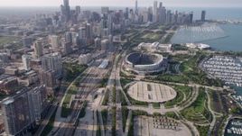 4.8K aerial stock footage tilt from Highway 41 to reveal Soldier Field and Downtown Chicago skyline, on a hazy day, Illinois Aerial Stock Footage | AX0001_020