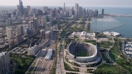 4.8K aerial stock footage approach Downtown Chicago and tilt down on Soldier Field, Illinois Aerial Stock Footage | AX0001_021