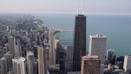 4.8K aerial stock footage tilt from N Michigan Avenue to reveal John Hancock Center, Downtown Chicago, Illinois Aerial Stock Footage | AX0001_030