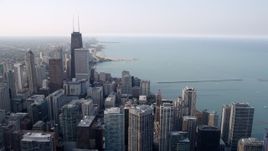 4.8K aerial stock footage panning across downtown skyscrapers beside Lake Michigan in Downtown Chicago, Illinois Aerial Stock Footage | AX0001_037