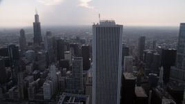 4.8K aerial stock footage Orbiting Aon Center, with Downtown Chicago skyscrapers in the background, Illinois Aerial Stock Footage | AX0001_051