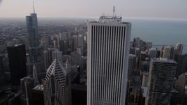 4.8K aerial stock footage flying by Aon Center, revealing Trump International and John Hancock Center in Downtown Chicago, Illinois Aerial Stock Footage | AX0001_052