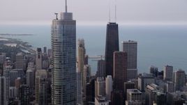 4.8K aerial stock footage of John Hancock Center, Trump International Hotel and Tower, Downtown Chicago, Illinois Aerial Stock Footage | AX0001_053