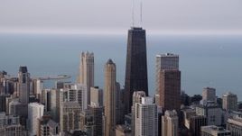 4.8K aerial  video of John Hancock Center in Downtown Chicago on a hazy day, Illinois Aerial Stock Footage | AX0001_054