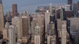 4.8K aerial stock footage flying by a group of high-rises and skyscrapers, Downtown Chicago skyscrapers, Illinois Aerial Stock Footage | AX0001_055