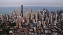 4.8K aerial stock footage of Downtown Chicago skyscrapers on a cloudy day, Illinois Aerial Stock Footage | AX0001_056