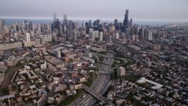 4.8K aerial stock footage tilt from streets by Interstate 90 and 94, revealing downtown skyline, Downtown Chicago, Illinois Aerial Stock Footage | AX0001_064