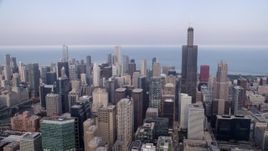 4.8K aerial of a view across Downtown Chicago on a hazy day, from Willis Tower to John Hancock Center, Illinois Aerial Stock Footage | AX0001_069