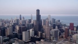4.8K aerial stock footage Downtown Chicago skyscrapers around Willis Tower on a hazy day; Chicago, Illinois Aerial Stock Footage | AX0001_071