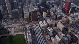 4.8K aerial stock footage tilt from LaSalle Street Station, revealing Downtown Chicago skyscrapers on a hazy day, Illinois Aerial Stock Footage | AX0001_080