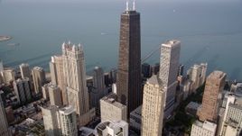 4.8K aerial stock footage tilt from high-rises to reveal John Hancock Center, Lake Michigan, Downtown Chicago, Illinois Aerial Stock Footage | AX0001_086