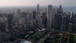 4.8K aerial stock footage fly over Grant Park, and tilt to Cloud Gate sculpture and Jay Pritzker Pavilion, Downtown Chicago, Illinois Aerial Stock Footage | AX0001_103