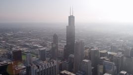 4.8K aerial stock footage of Willis Tower on a hazy day, Downtown Chicago, Illinois Aerial Stock Footage | AX0001_106