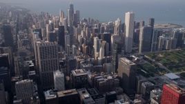 4.8K aerial stock footage downtown Chicago buildings and skyscrapers, on a hazy day, Illinois Aerial Stock Footage | AX0001_114