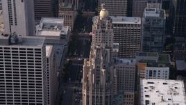 4.8K aerial  video approach flag flying at top of Tribune Tower in Downtown Chicago, Illinois Aerial Stock Footage | AX0001_118