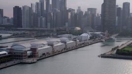 4.8K aerial stock footage tilting up from Navy Pier to downtown Chicago skyscrapers, Illinois Aerial Stock Footage | AX0001_126