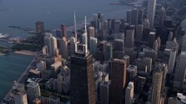 4.8K aerial stock footage of the top of John Hancock Center and downtown Chicago skyscrapers, Illinois Aerial Stock Footage | AX0001_128