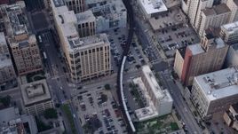 4.8K aerial stock footage of a bird's eye view tracking an L Train through Downtown Chicago, Illinois Aerial Stock Footage | AX0001_145