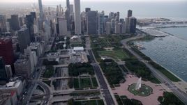 4.8K aerial stock footage tilt from the Buckingham Fountain in Grant Park to reveal skyscrapers, Downtown Chicago, Illinois Aerial Stock Footage | AX0001_151