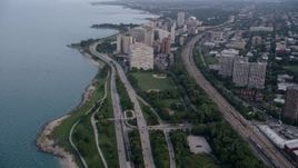 4.8K aerial stock footage tilt from Highway 41 and reveal Hyde Park apartment buildings, on a hazy day, Chicago, Illinois Aerial Stock Footage | AX0001_157