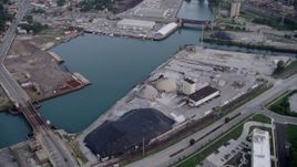 4.8K aerial stock footage tilting up the Calumet River, revealing industrial buildings and bridges, East Side Chicago, Illinois Aerial Stock Footage | AX0001_163